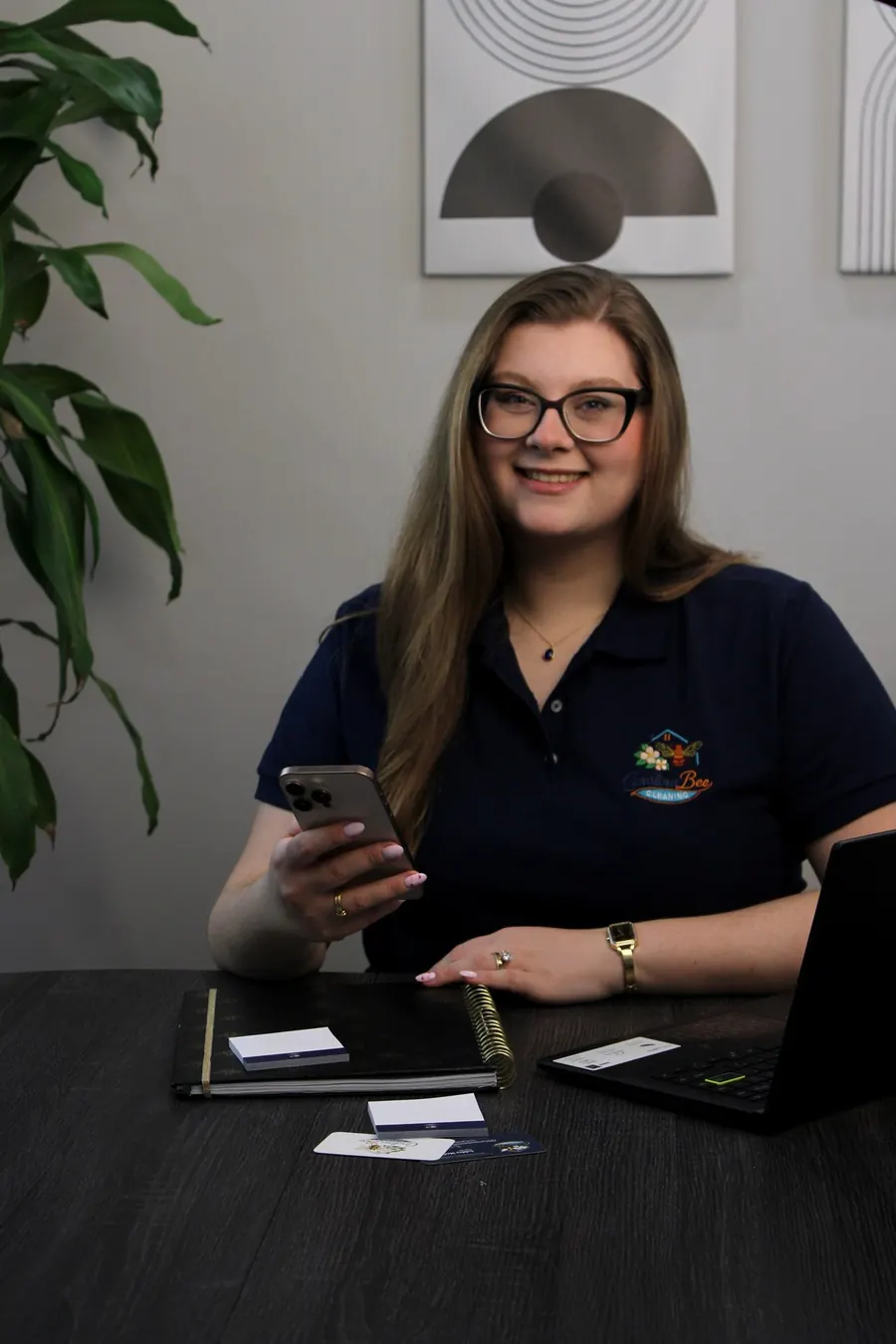 Ashley, owner of Carolina Bee Cleaning, at her desk